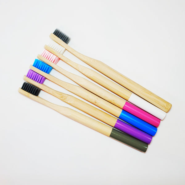 6 bamboo toothbrushes of different colours.  Grey, purple, blue, pink, white and plain.