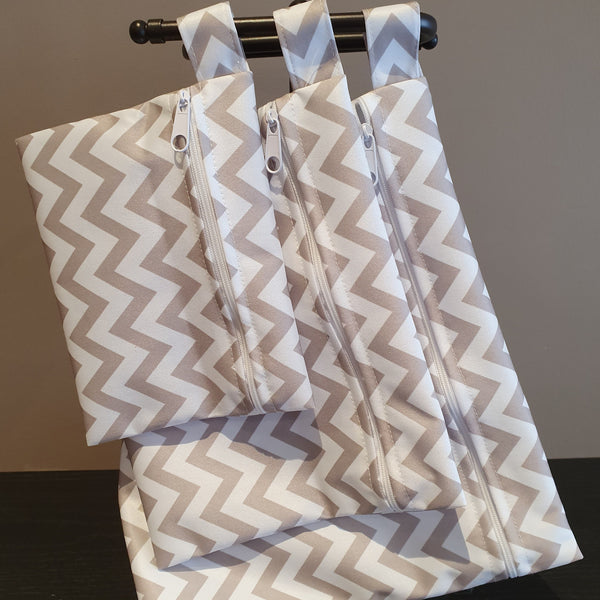 3 pack reusable waterproof food grade safe bags with grey chevron pattern.  Hanging for size.