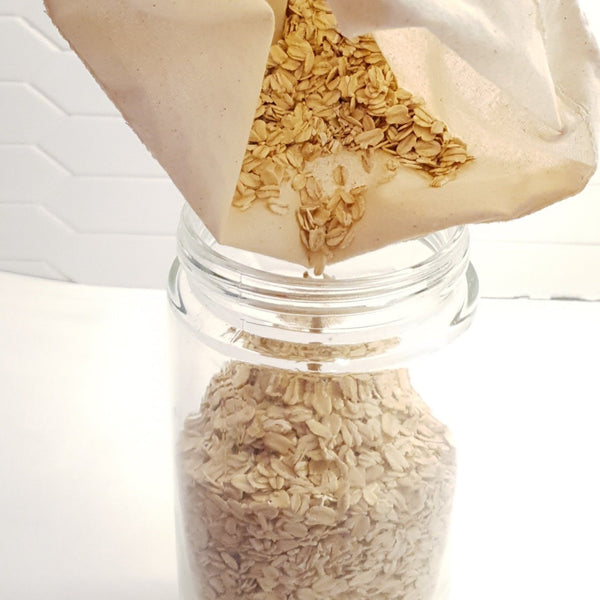 2 pack bulk bags made out of 100% cotton. The bag in the photo is filled with seeds emptying into a container.