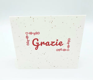 Plantable seed card with "Grazie" in pink.