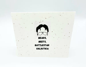 Plantable seed paper card with outline of The Office Dwight Shrute's face "Bears, Beets, Battlestar Gallactica."