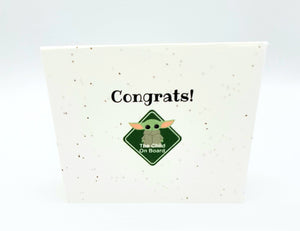 Plantable seed card with Image of baby alien (Child on board) and "Congrats!"