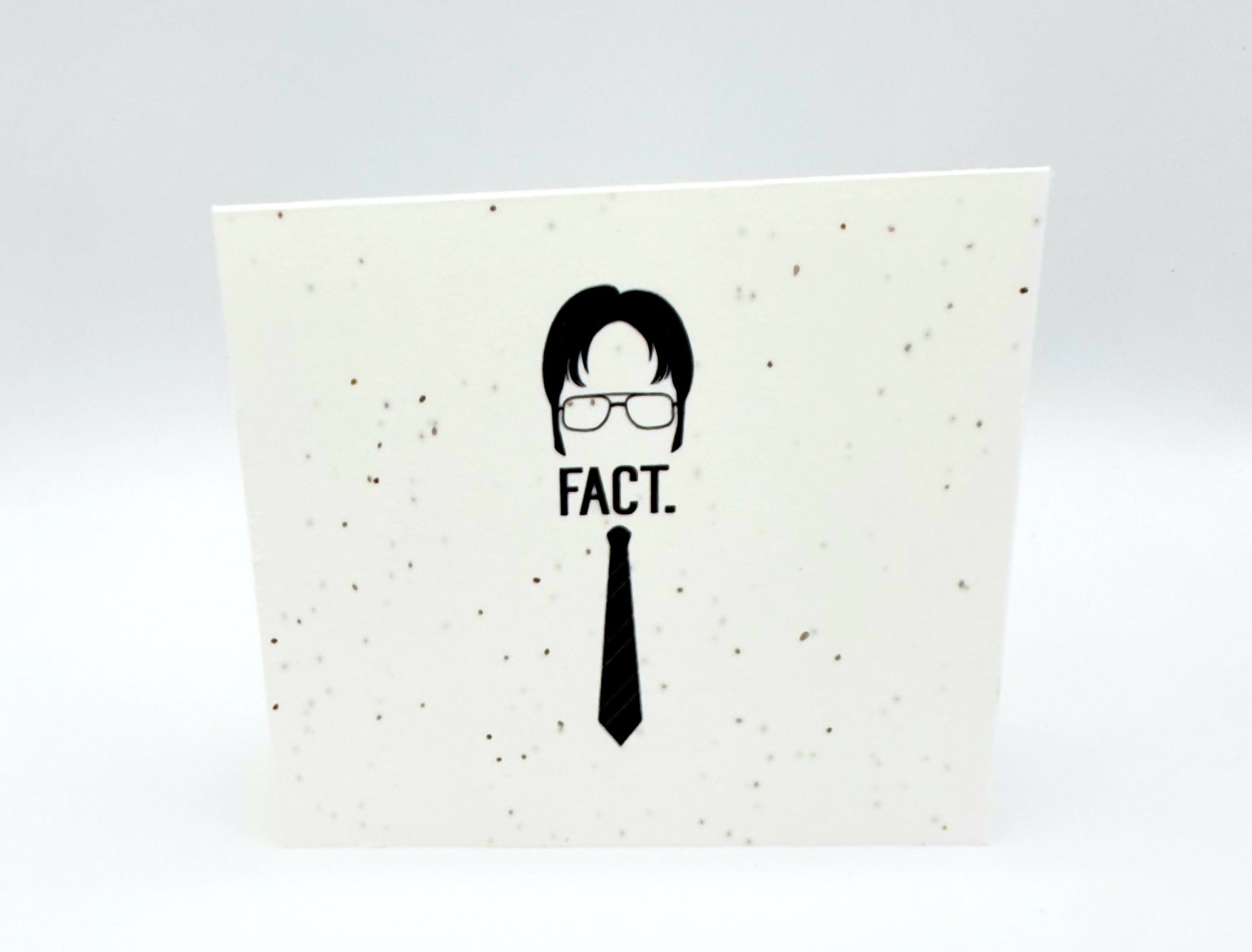 Plantable seed card with outline of The Office Dwight Shrute and "Fact."