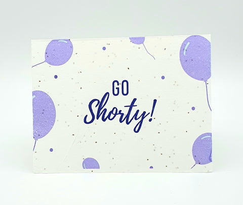 Plantable seed card with purple balloons and "Go Shorty!" in purple.