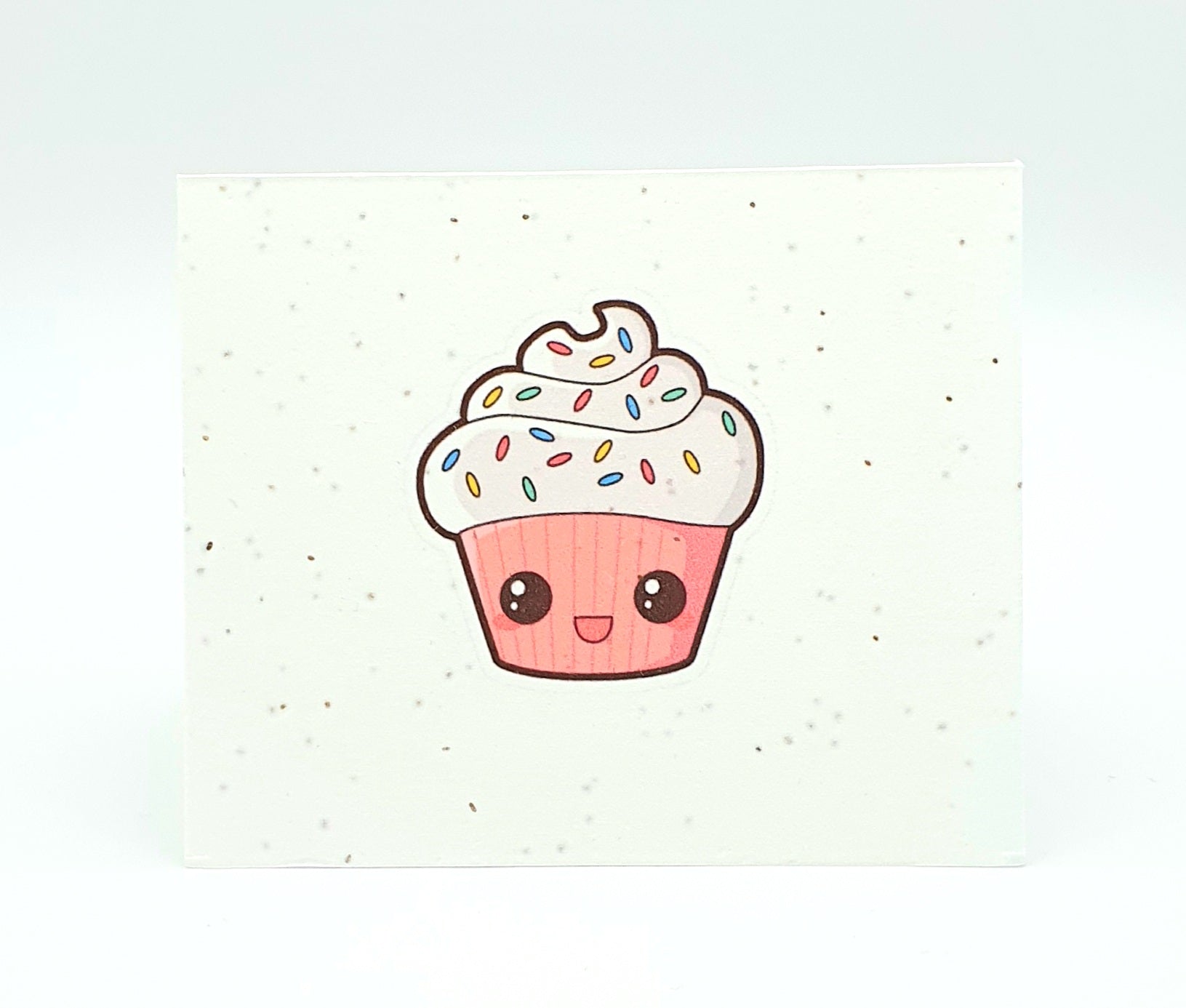 Plantable seed card with Pink cupcake, sprinkels and face.