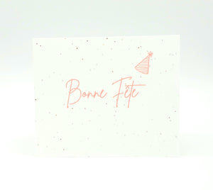 Plantable seed card with "Bonne Fete" in pink ink.