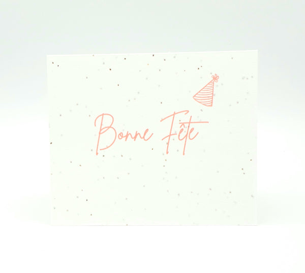 Plantable seed card with "Bonne Fete" in pink ink.