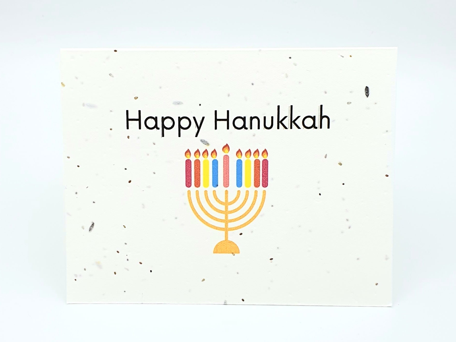 Plantable seed card with Happy Hanukkah and Menorah.
