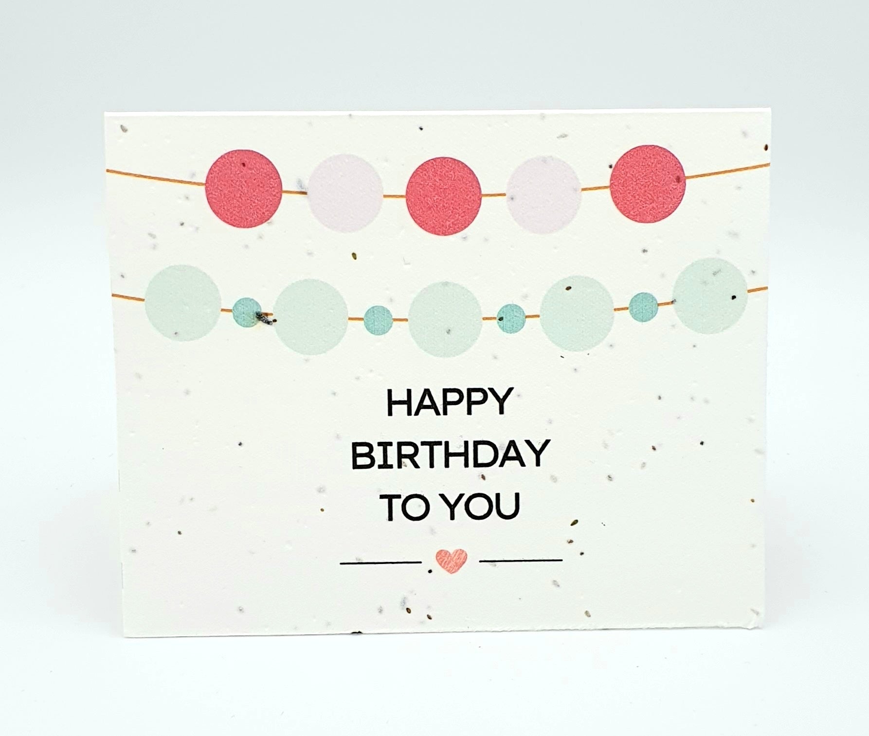 Plantable seed card with "Happy Birthday to you" and round banners.