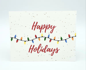 Plantable Seed paper card with Happy Holidays and colourful string lights.