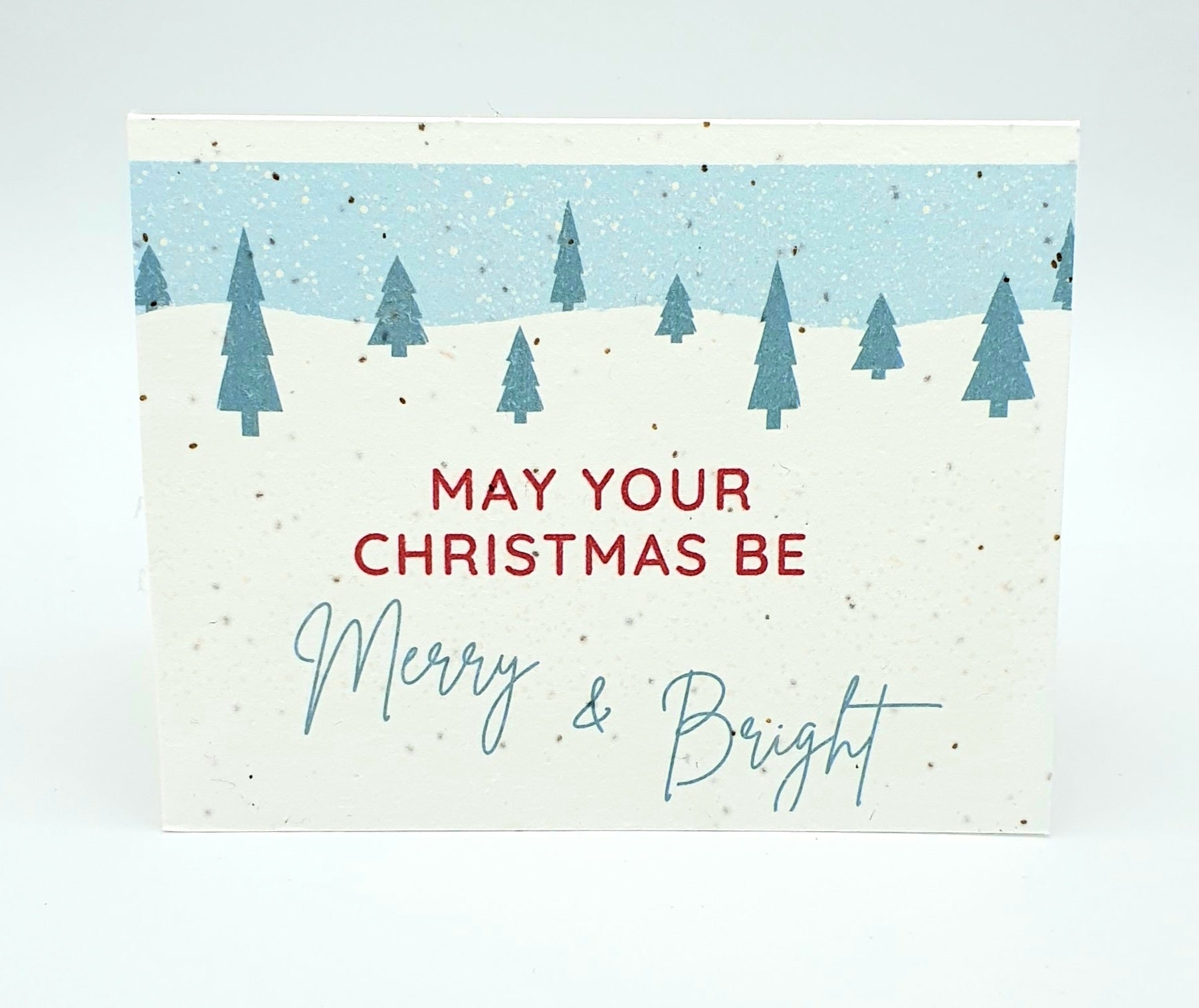 Plantable seed card with May your Christmas be Merry & Bright and small Christmas trees.