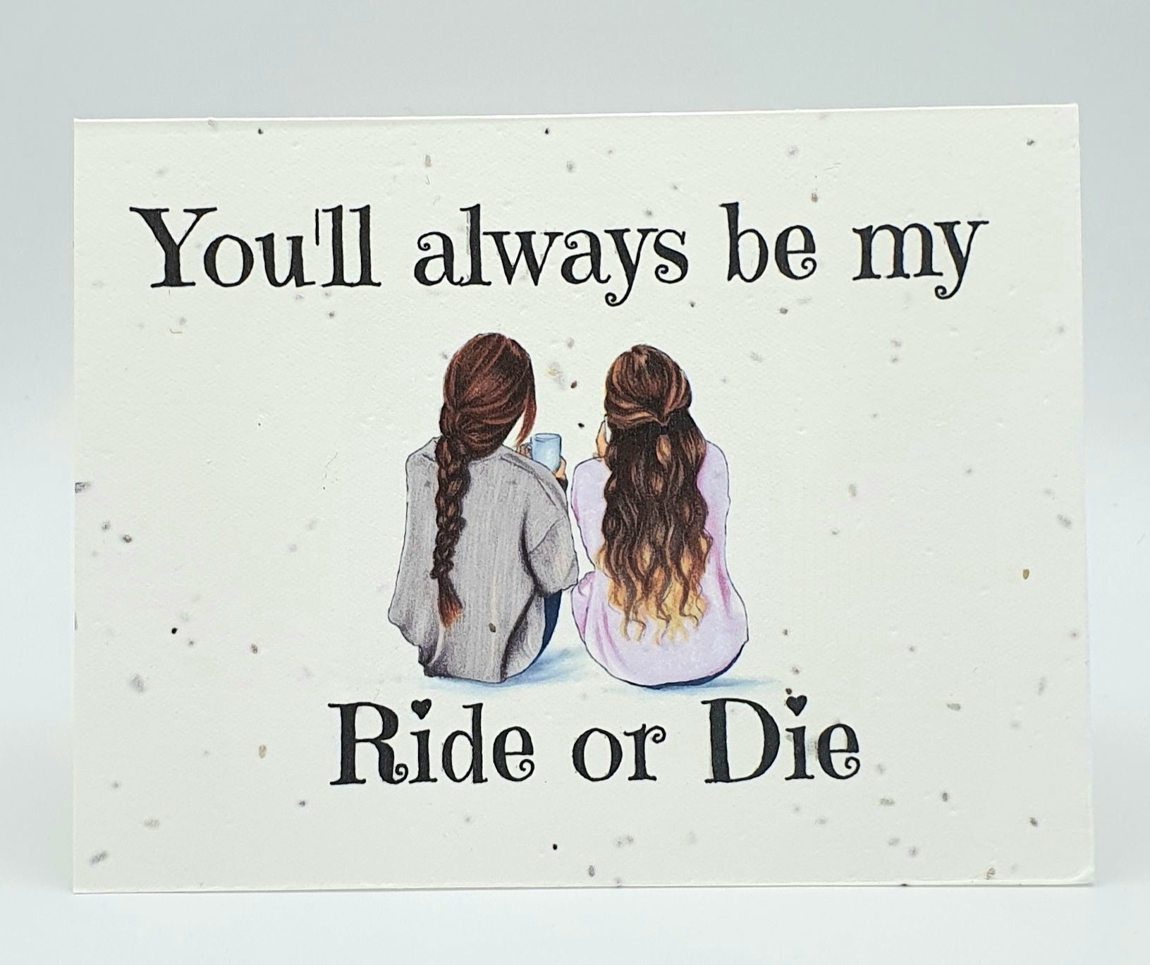 Plantable seed paper card with black ink You'll always be my Ride or Die with two brunettes sitting next to each from behind.