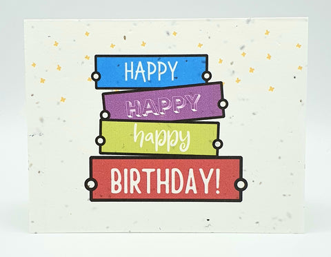 Plantable seed card with different coloured banners "Happy Happy Happy Birthday!"