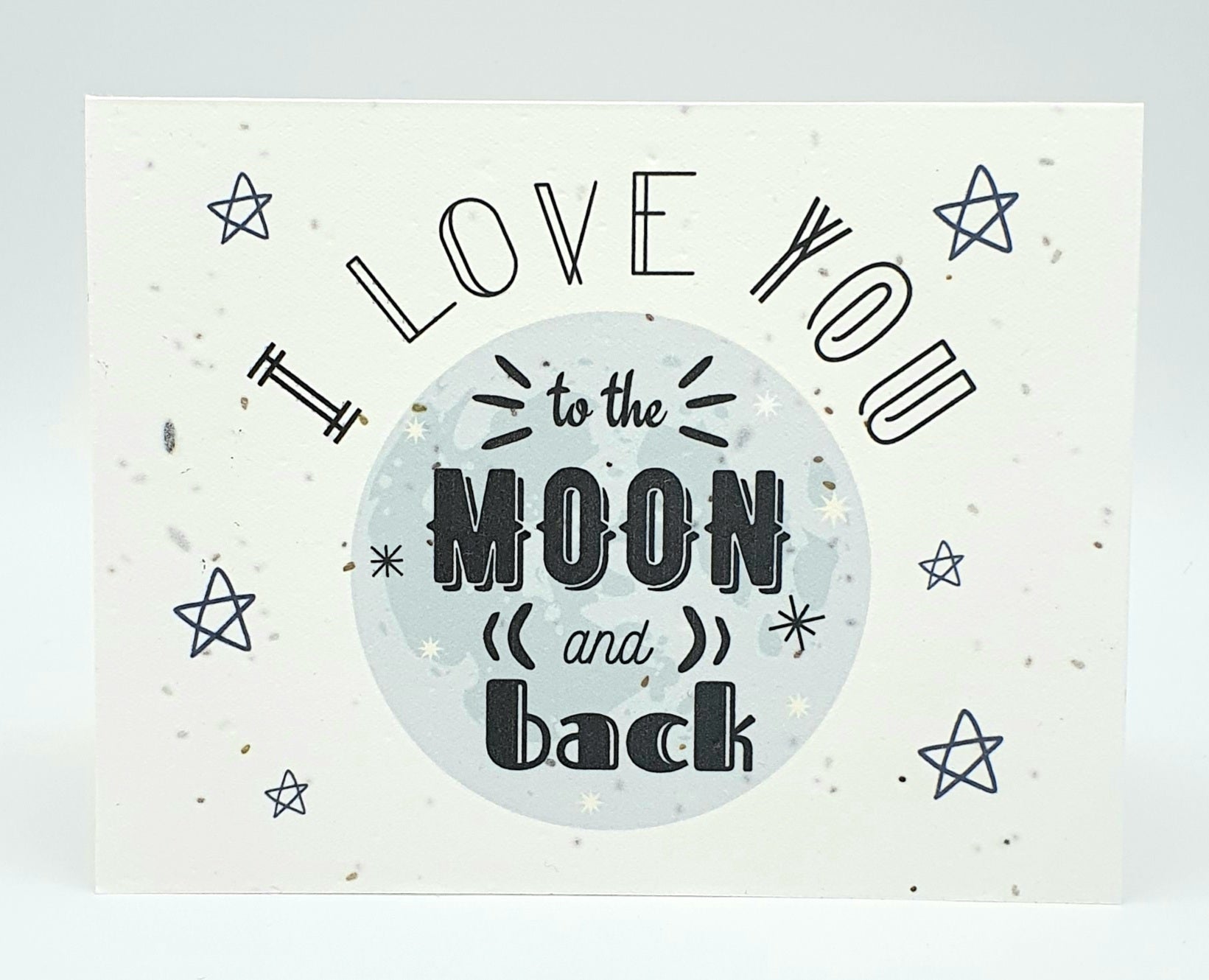 Plantable seed paper card with moon and stars design and I Love You to the Moon and back message.
