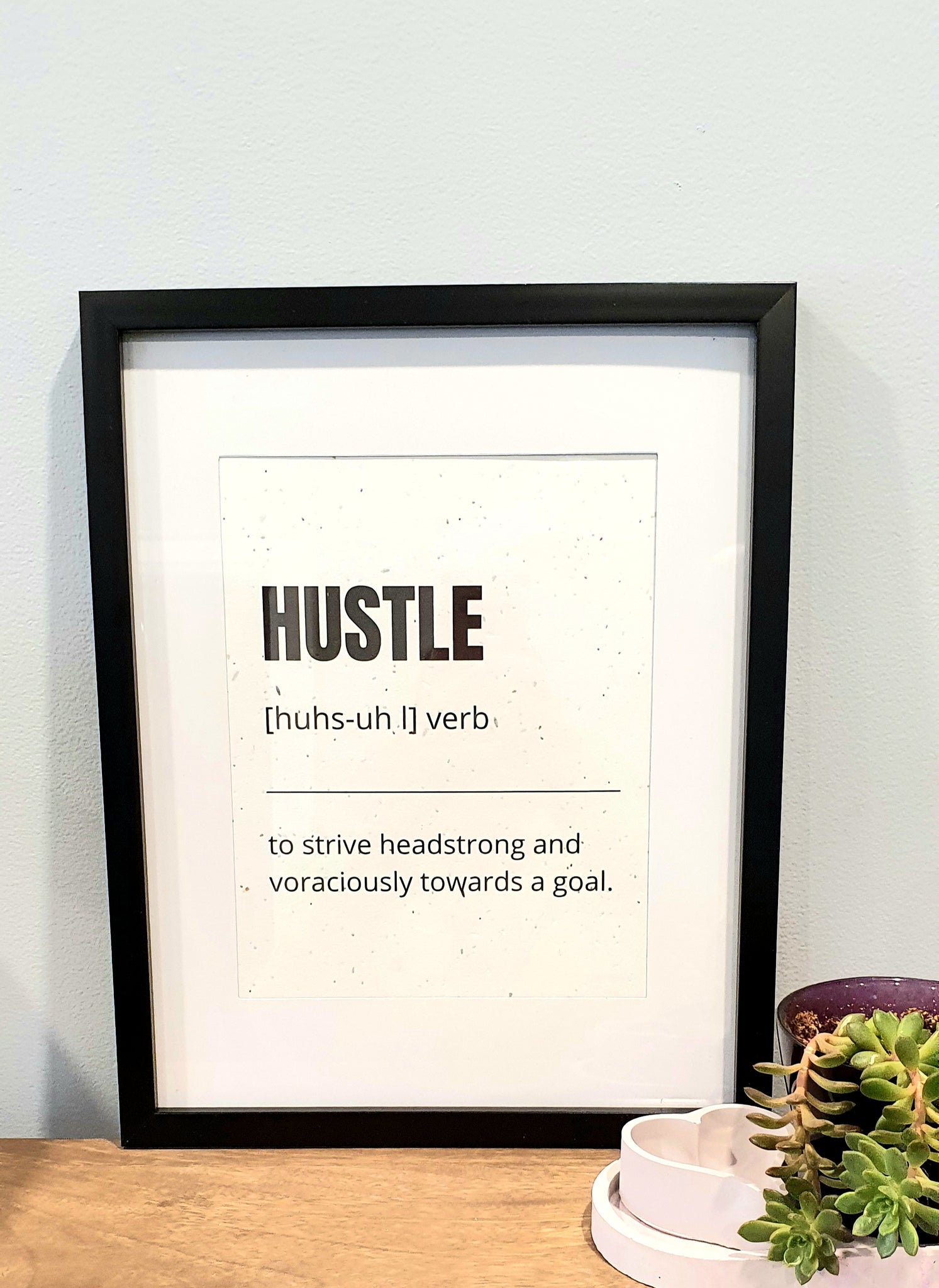 Plantable seed 8.5 x 11 print with "Hustle - to strive headstrong and voraciously towards a goal".