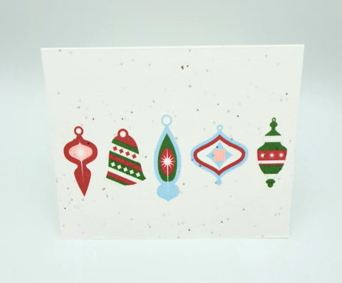 Plantable seed paper card with five vintage looking Christmas ornaments in blue green and red.