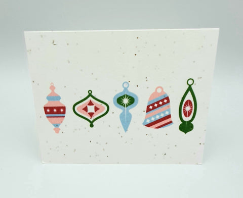 Plantable seed paper card with five vintage looking ornaments in pink, blue and green.