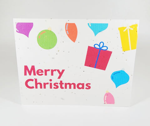 Plantable seed paper card Merry Christmas with various coloured presents and ornaments