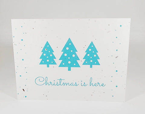 Plantable seed paper card Christmas is here with three blue Christmas trees
