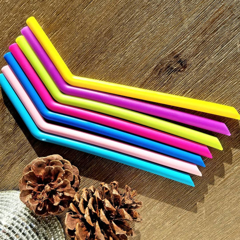Various colours reusable silicone bent straws.