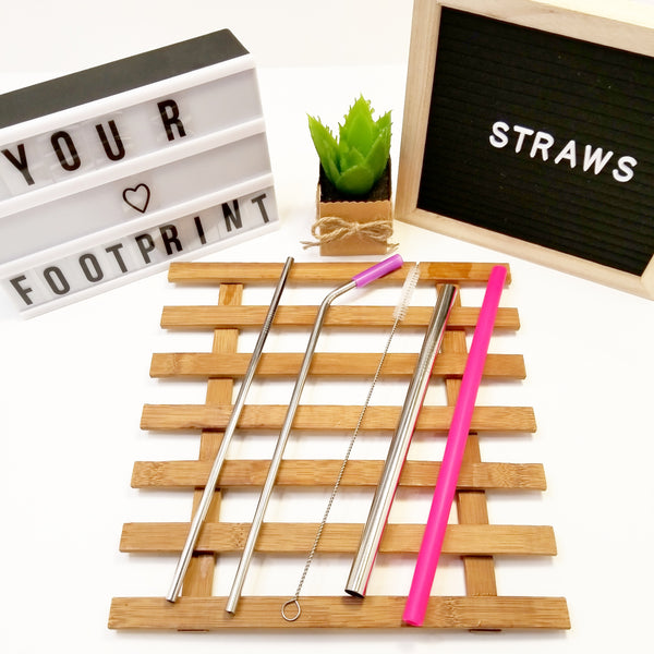 Various reusable stainless steel straws, straight, bent, smoothie, straw brush and silicone straw.